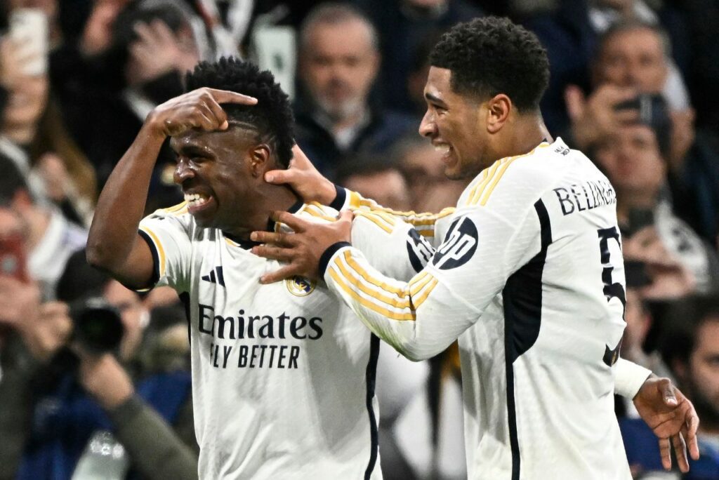 Vini Jr. e Bellingham durante partida da Champions League
