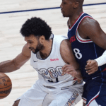 Jamal Murray arremessando durante um jogo de playoffs da NBA pelo Denver Nuggets.